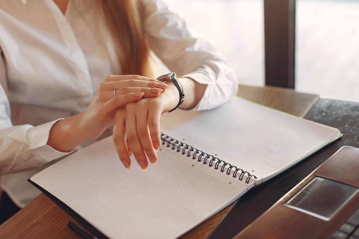 woman looking at watch