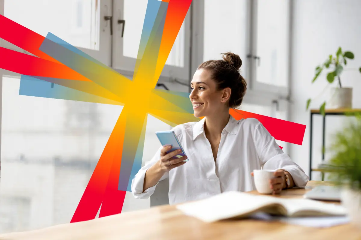 woman in white shirt, holding a mobile phone and a cup. SD Worx spark in the background